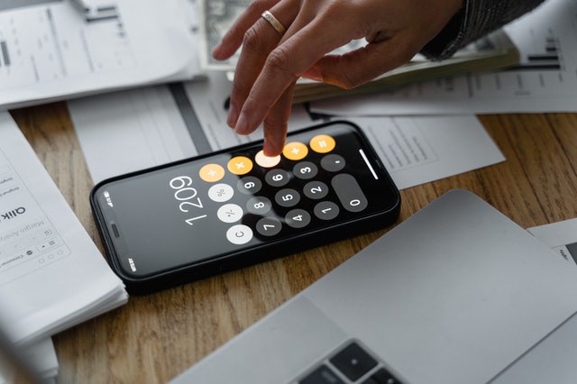 A person calculating tax on workcover payments